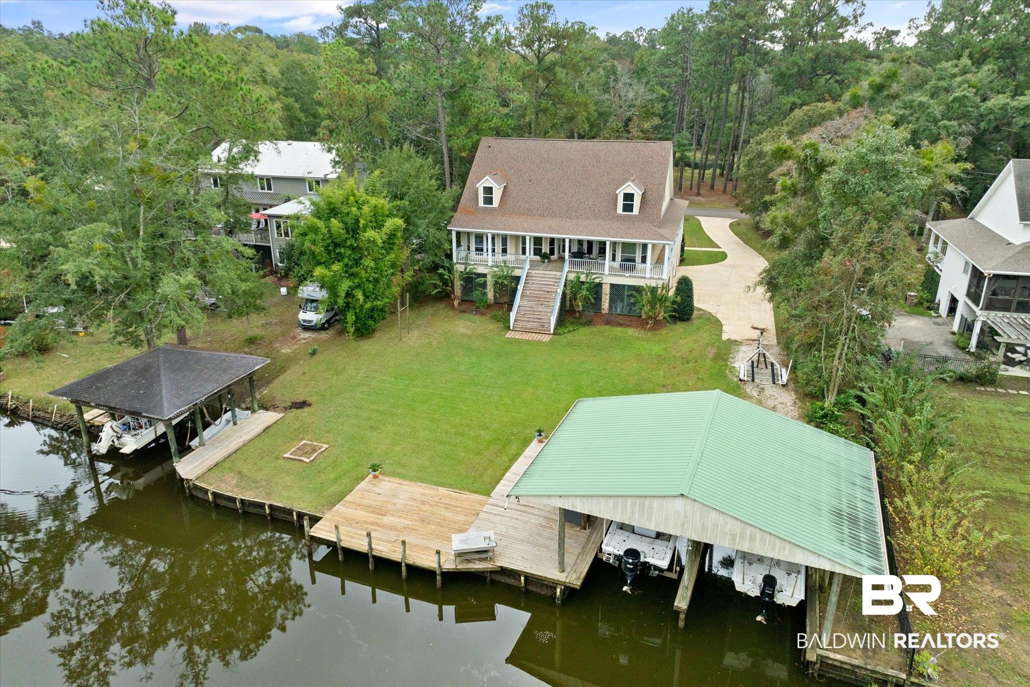 3500 North Riviere Du Chien Loop Mobile, AL 36693 - Photo 1 of 74 Exterior space with a water view and a lawn