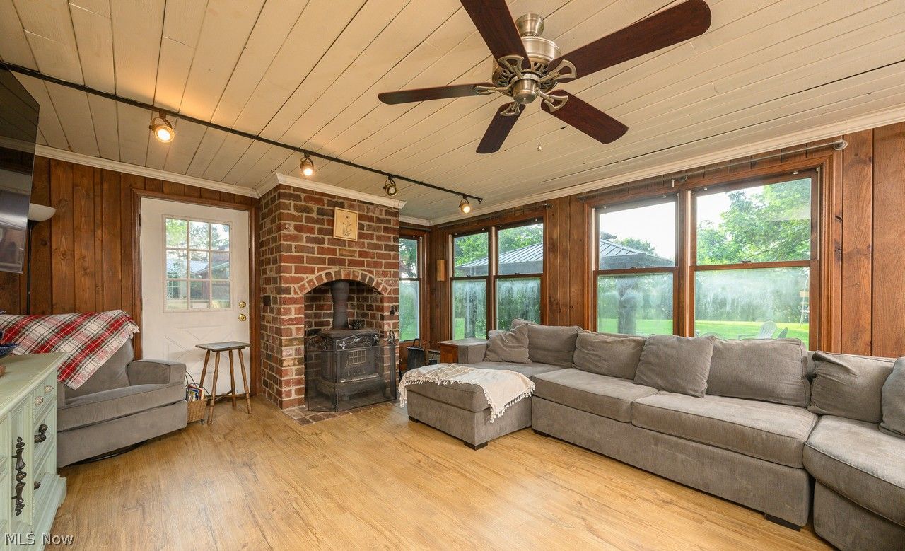 3912 Rolling Ridge Road Northeast Canton, OH 44721 - Photo 3 of 33 Awesome family room addition with tons of windows wood-burning stove and pine ceiling