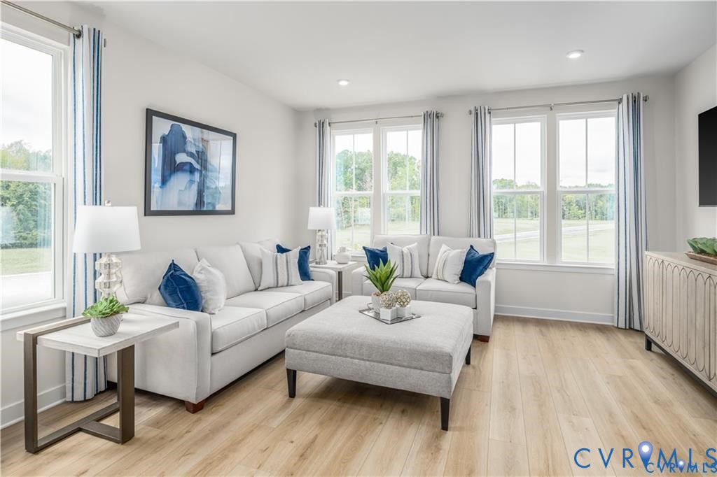 12723 Clover Way Midlothian, VA 23112 - Photo 6 of 23 a living room with furniture and a large window