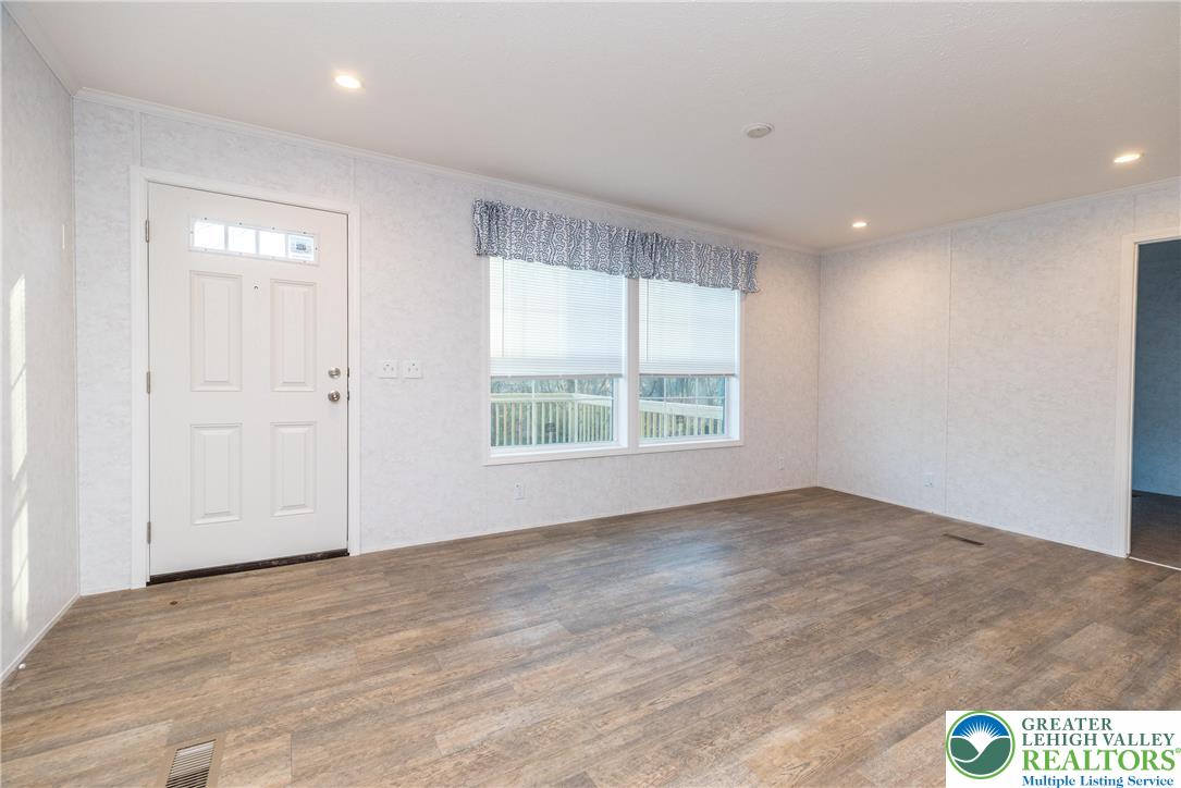 465 Royal Manor Road, Unit LOT 8 Easton, PA 18042 - Photo 7 of 23 an empty room with wooden floor and windows