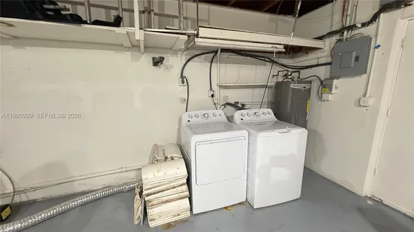 a utility room with dryer and washer