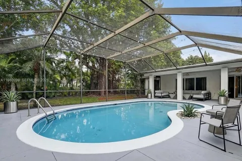 a view of a swimming pool with a patio