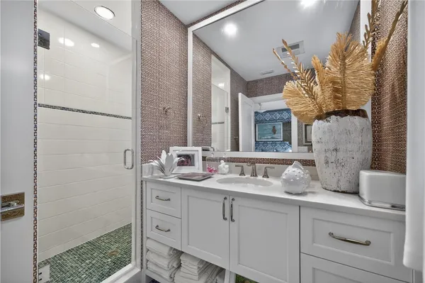 a bathroom with a double vanity sink and a mirror