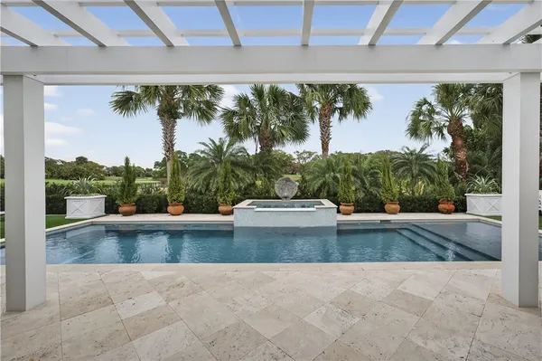 a view of a swimming pool with a yard