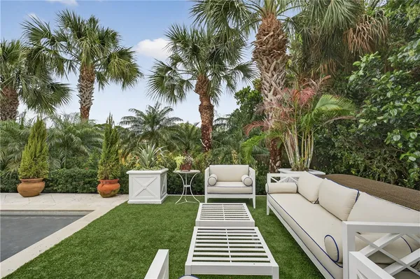 a view of a patio with couches and a fire pit