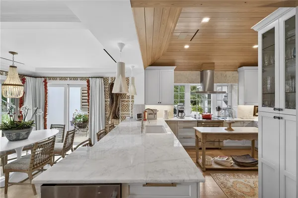 a large white kitchen with lots of counter space