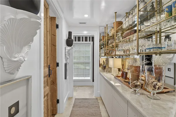 a very nice looking room with a large window and storage