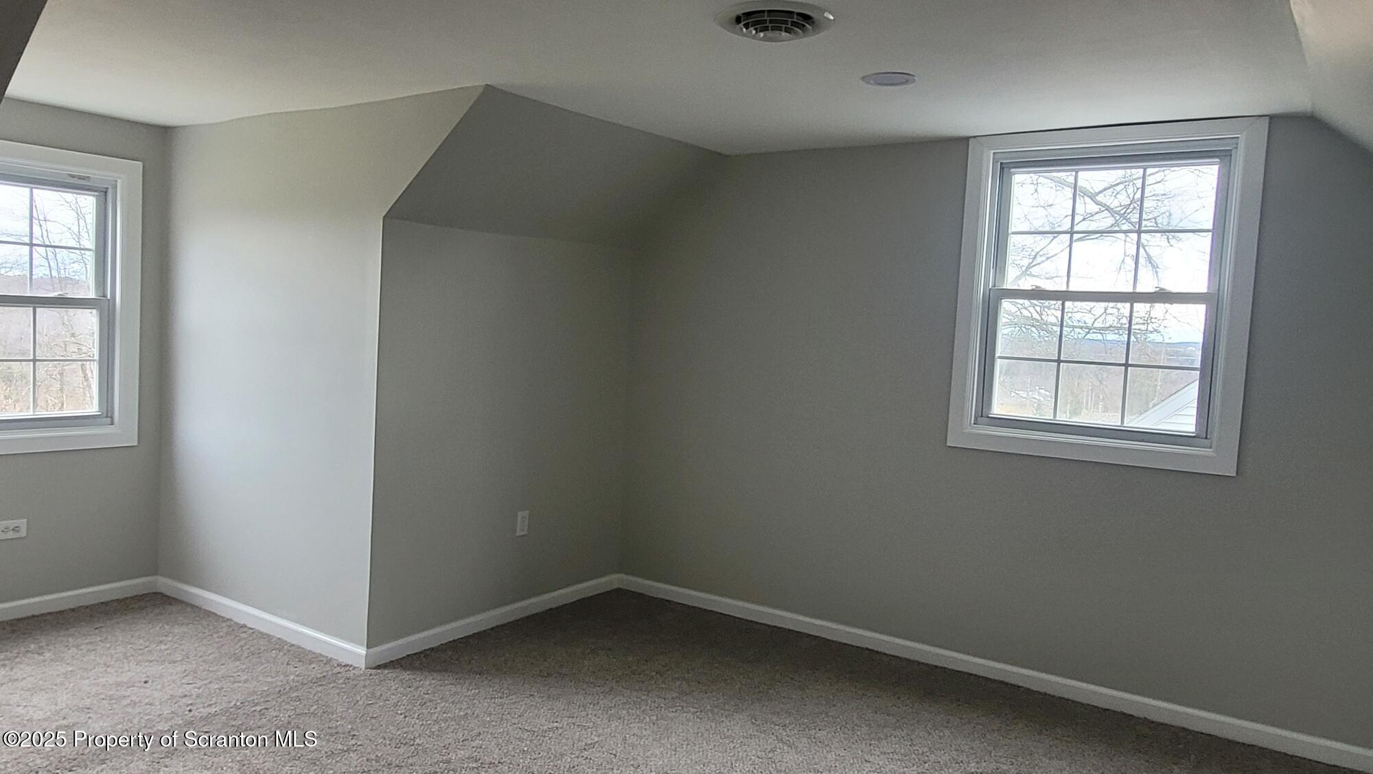 821 Mitchell Road Meshoppen, PA 18630 - Photo 44 of 58 an empty room with windows
