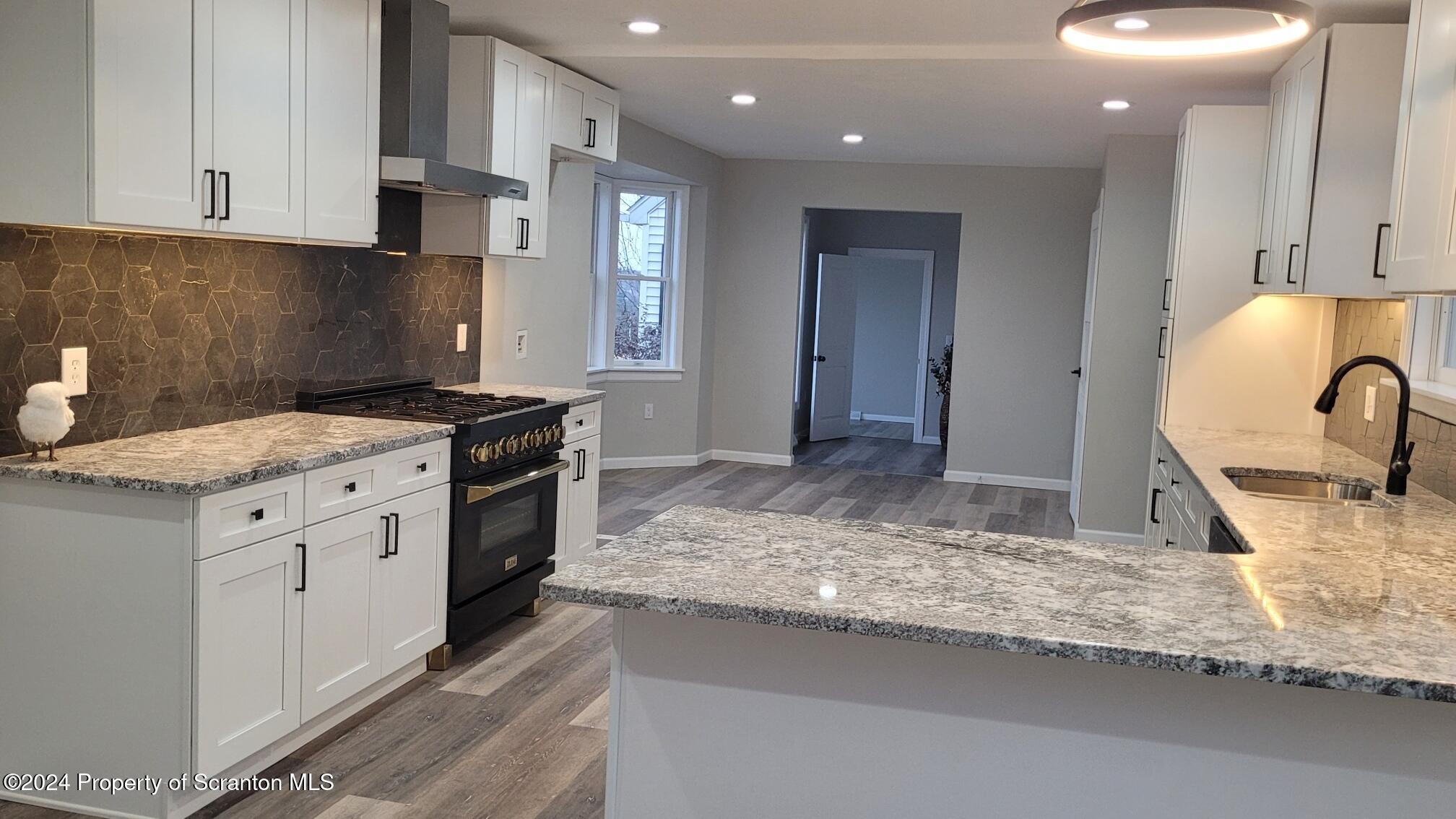 821 Mitchell Road Meshoppen, PA 18630 - Photo 8 of 58 a kitchen that has a sink and a stove