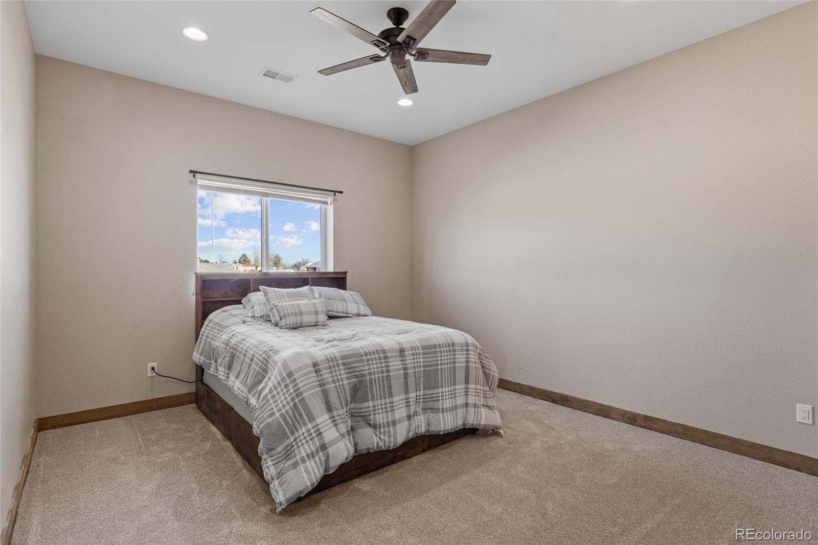 903 Liptrap Street Simla, CO 80835 - Photo 19 of 37 a bedroom with a bed and window