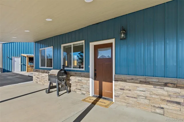 an entryway at livingroom with furniture and wooden floor