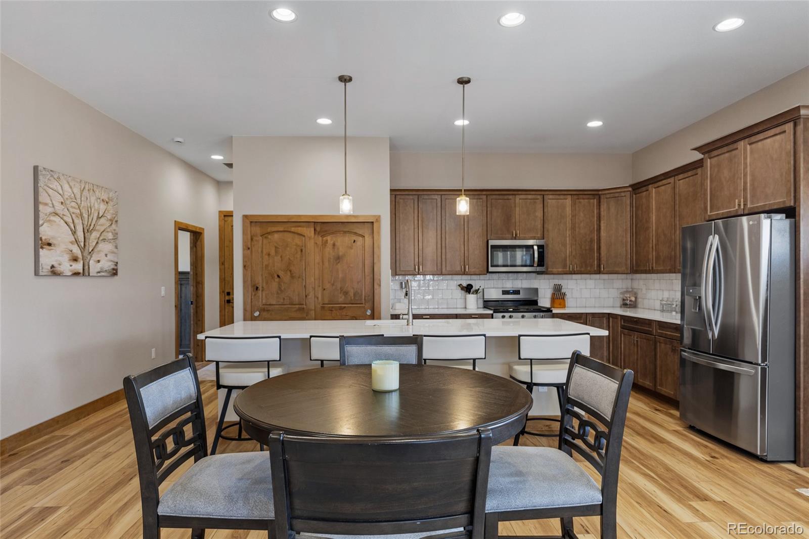 903 Liptrap Street Simla, CO 80835 - Photo 7 of 37 a kitchen with a table chairs refrigerator and microwave