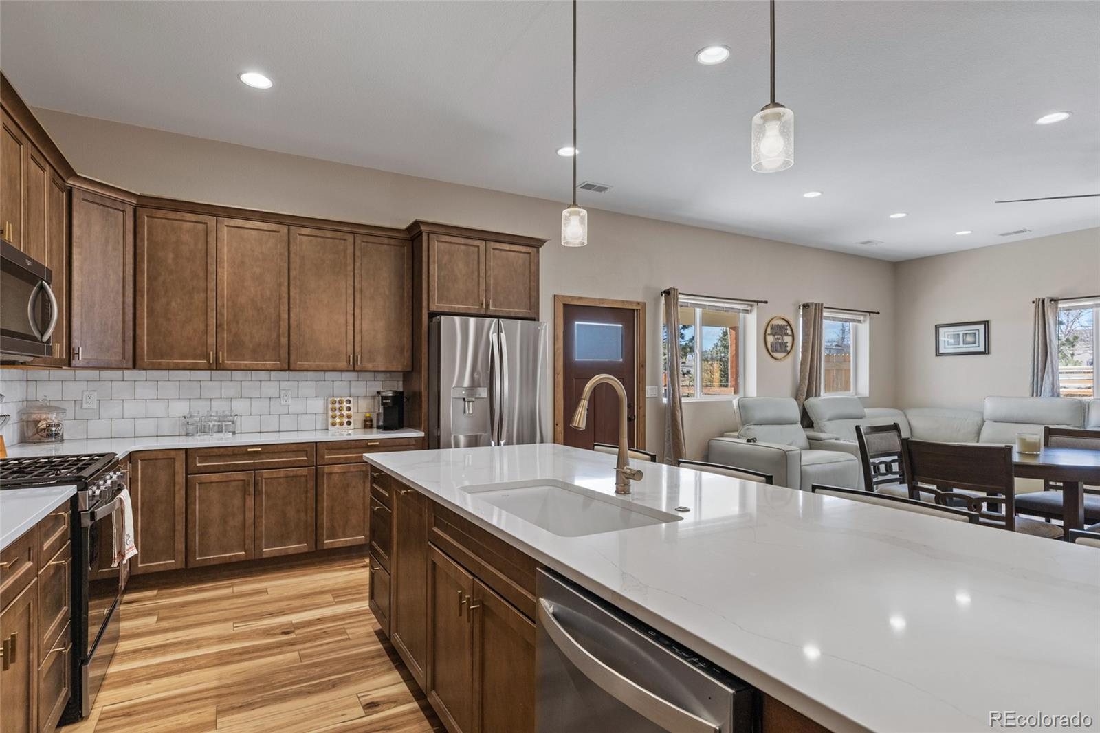 903 Liptrap Street Simla, CO 80835 - Photo 10 of 37 a large kitchen with kitchen island a sink stainless steel appliances and cabinets