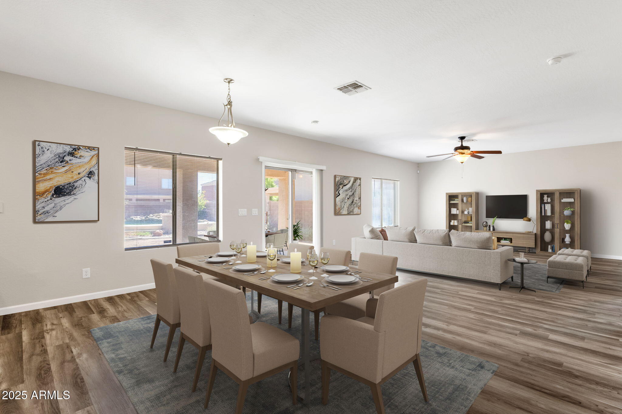 43003 West Magnolia Road Maricopa, AZ 85138 - Photo 9 of 32 a view of a dining room with furniture window and wooden floor
