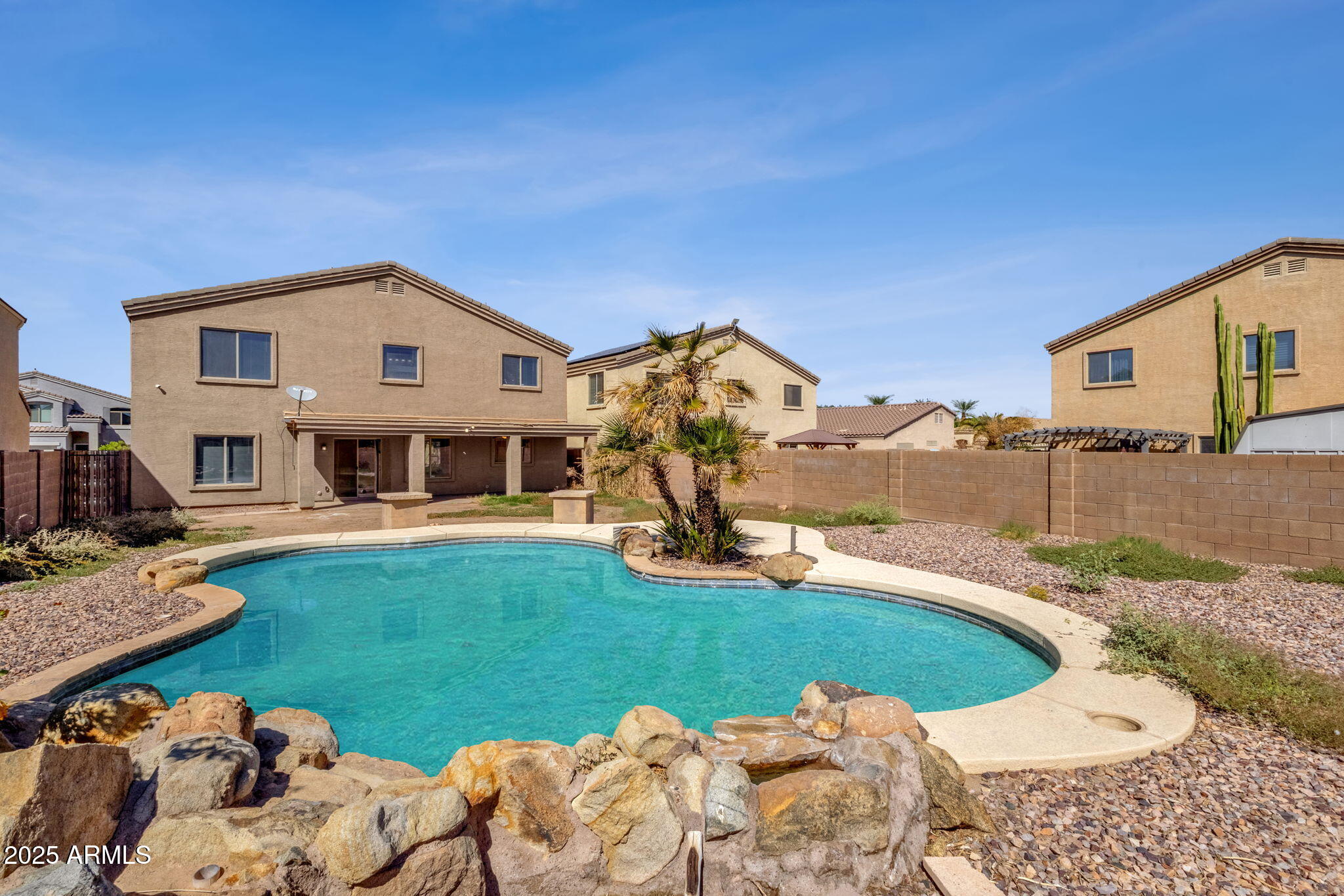 43003 West Magnolia Road Maricopa, AZ 85138 - Photo 11 of 32 a front view of a house with garden
