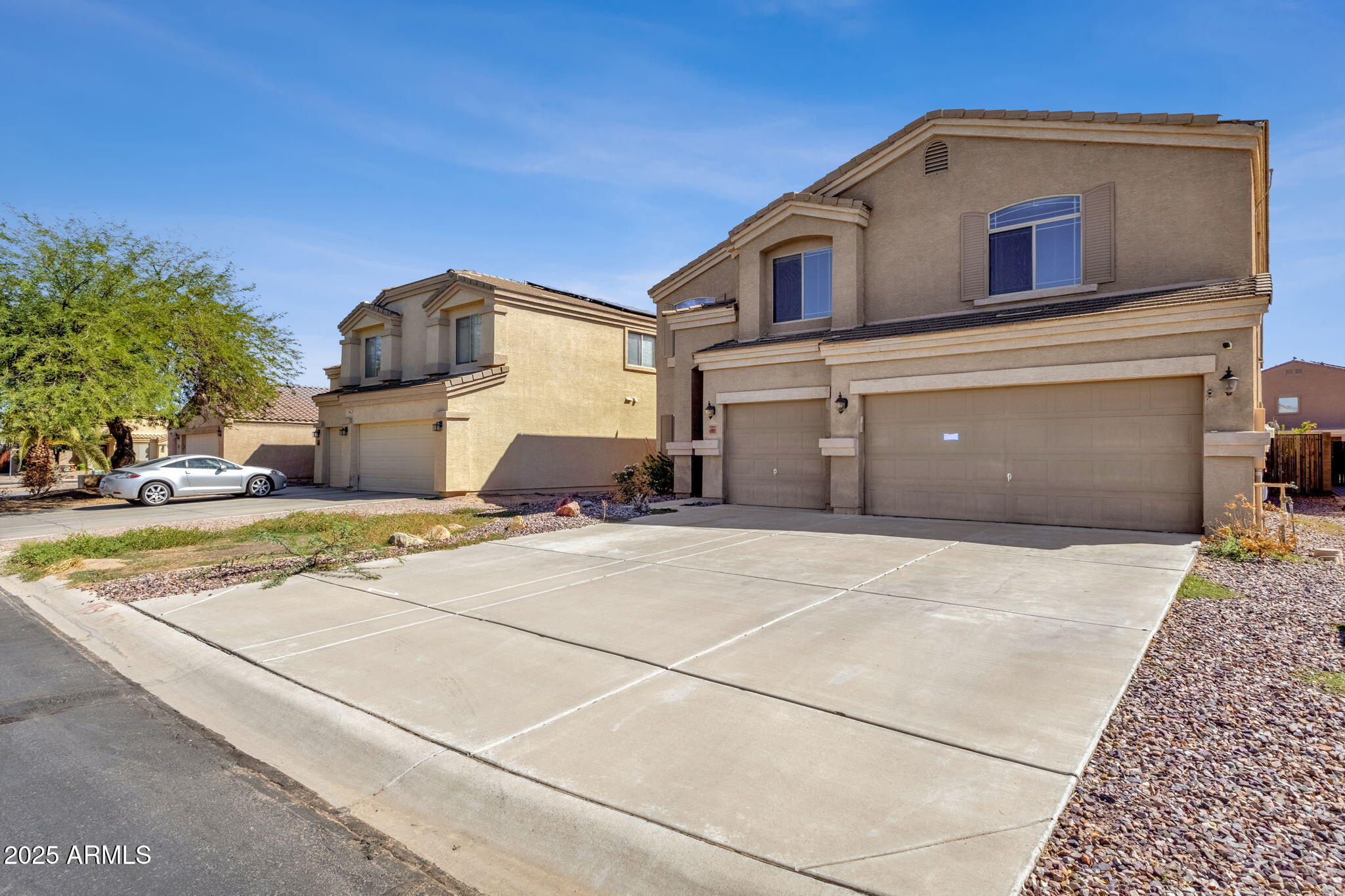 43003 West Magnolia Road Maricopa, AZ 85138 - Photo 12 of 32 a front view of a house with a yard