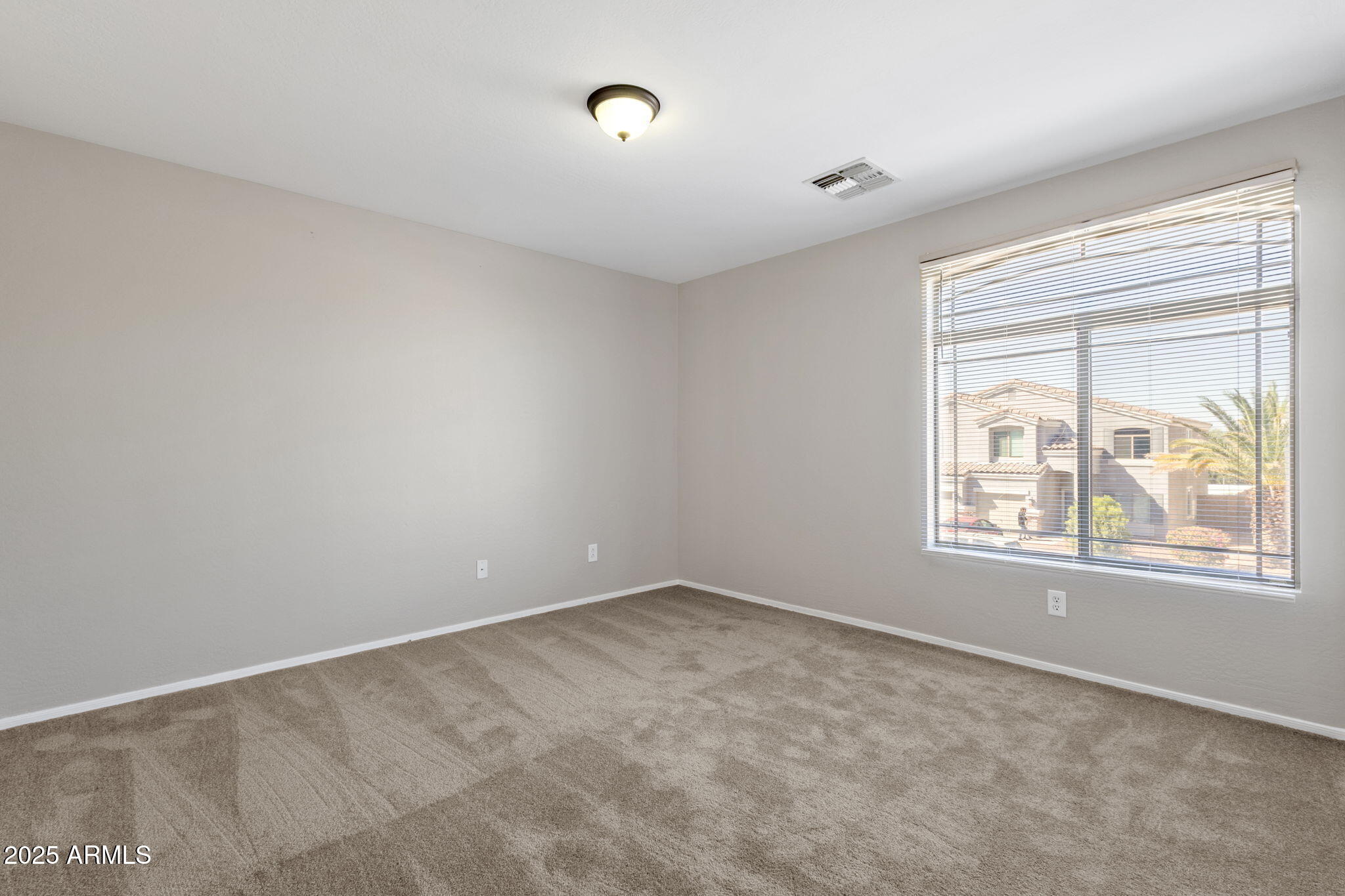 43003 West Magnolia Road Maricopa, AZ 85138 - Photo 26 of 32 an empty room with windows