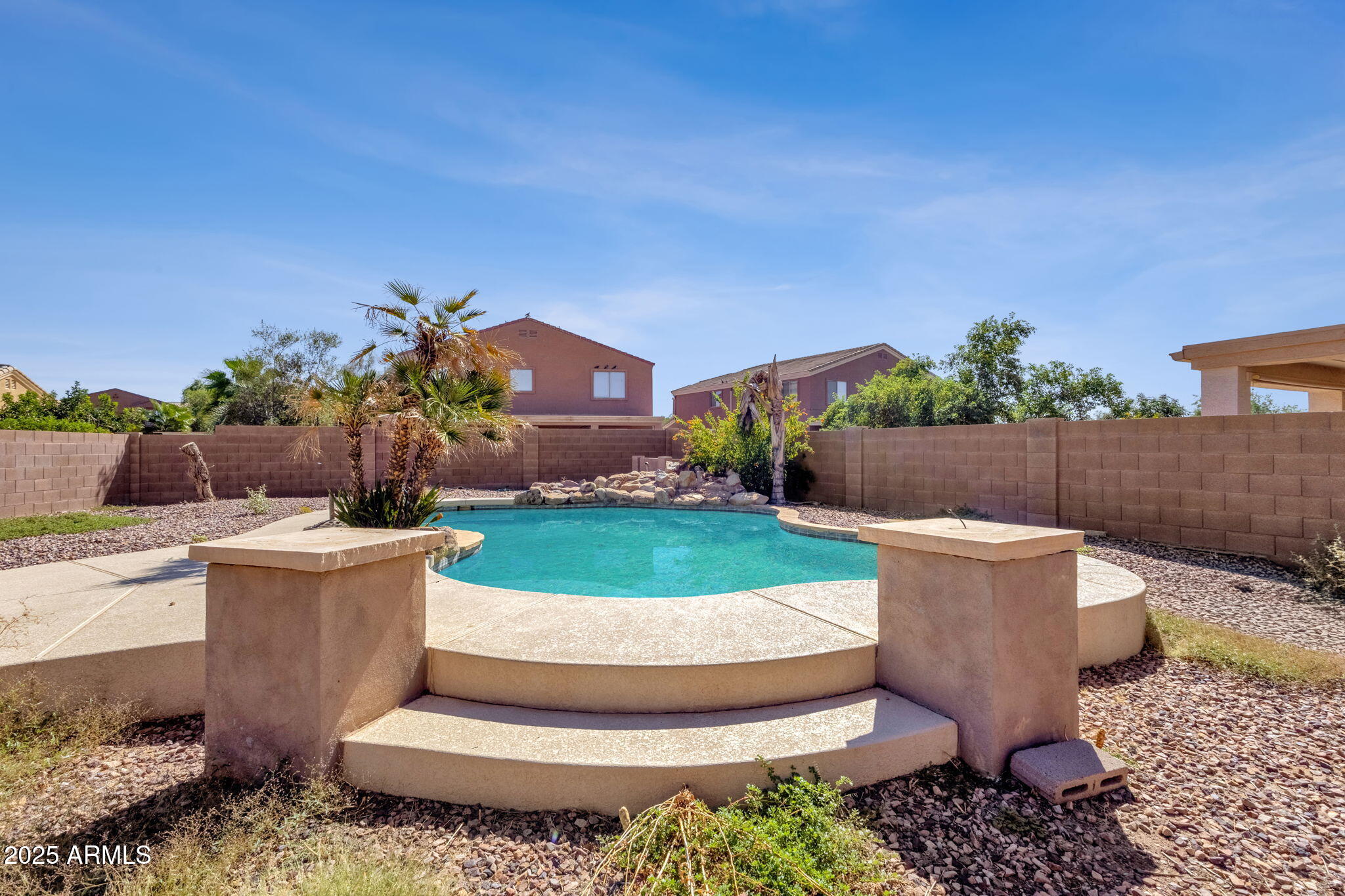 43003 West Magnolia Road Maricopa, AZ 85138 - Photo 28 of 32 a view of a backyard with plants and patio