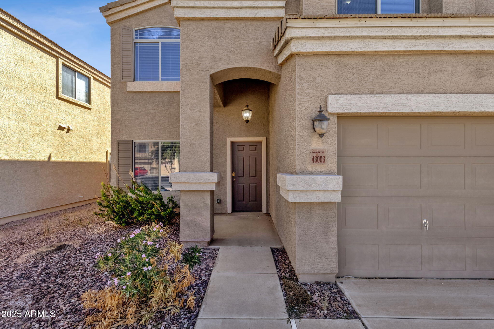 43003 West Magnolia Road Maricopa, AZ 85138 - Photo 30 of 32 a front view of a house with a yard