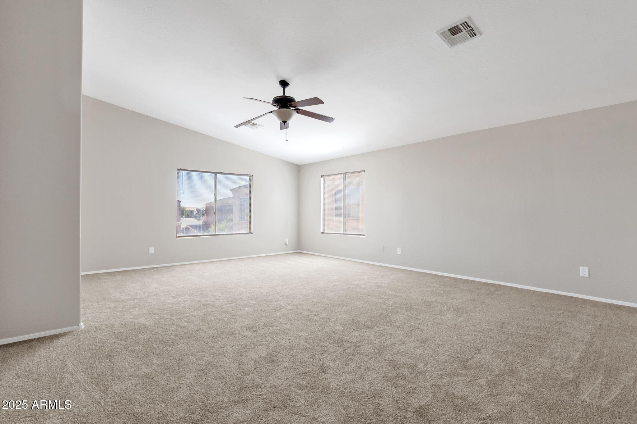 43003 West Magnolia Road Maricopa, AZ 85138 - Photo 6 of 32 a view of an empty room with a window