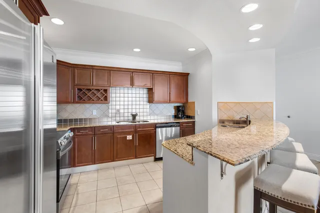 a view of a kitchen with a sink and cabinets