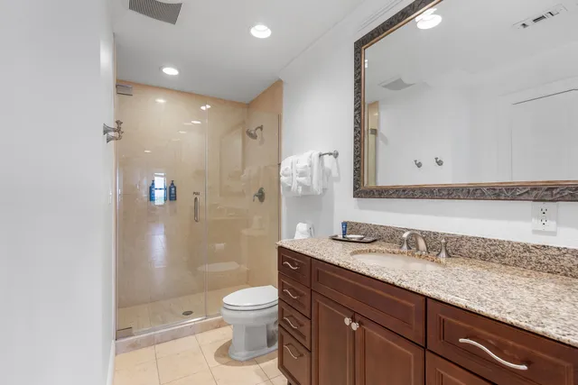 a bedroom with a bed and a fireplace