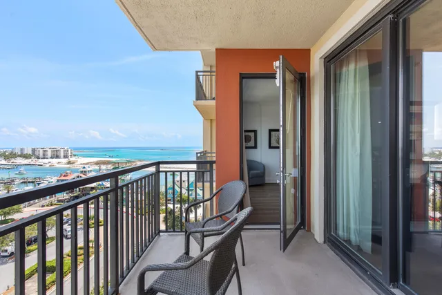 a large bathroom with a granite countertop sink a toilet a mirror and shower