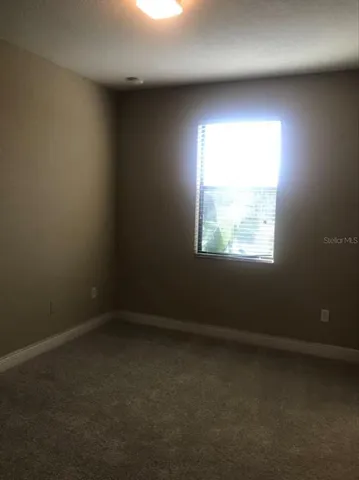 an empty room with closet area