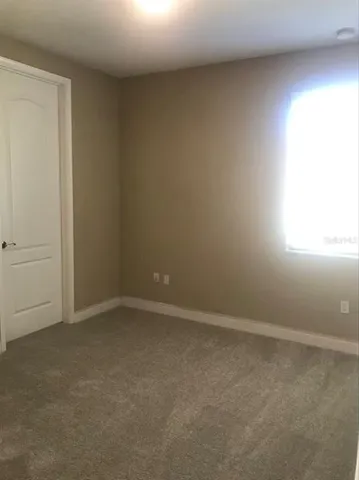 a bathroom with a toilet and a bath tub