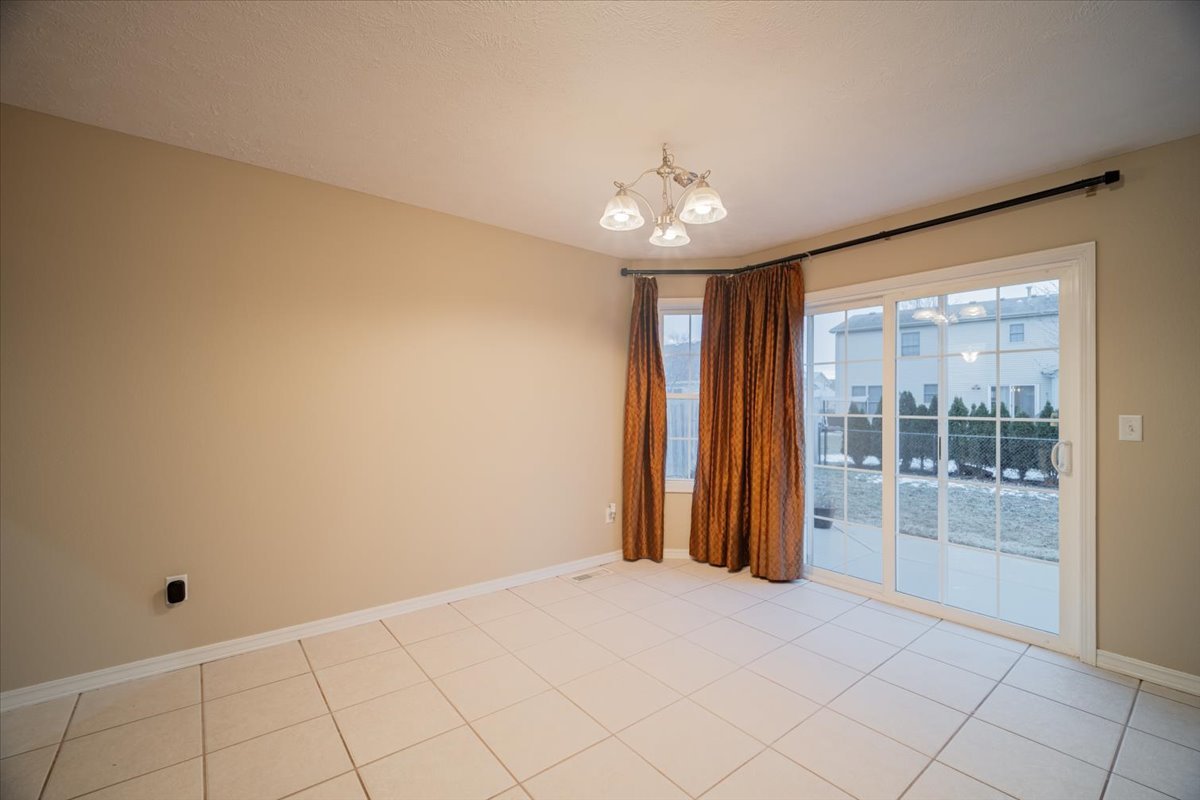 2885 East Raab Road Normal, IL 61761 - Photo 11 of 35 en empty room with windows