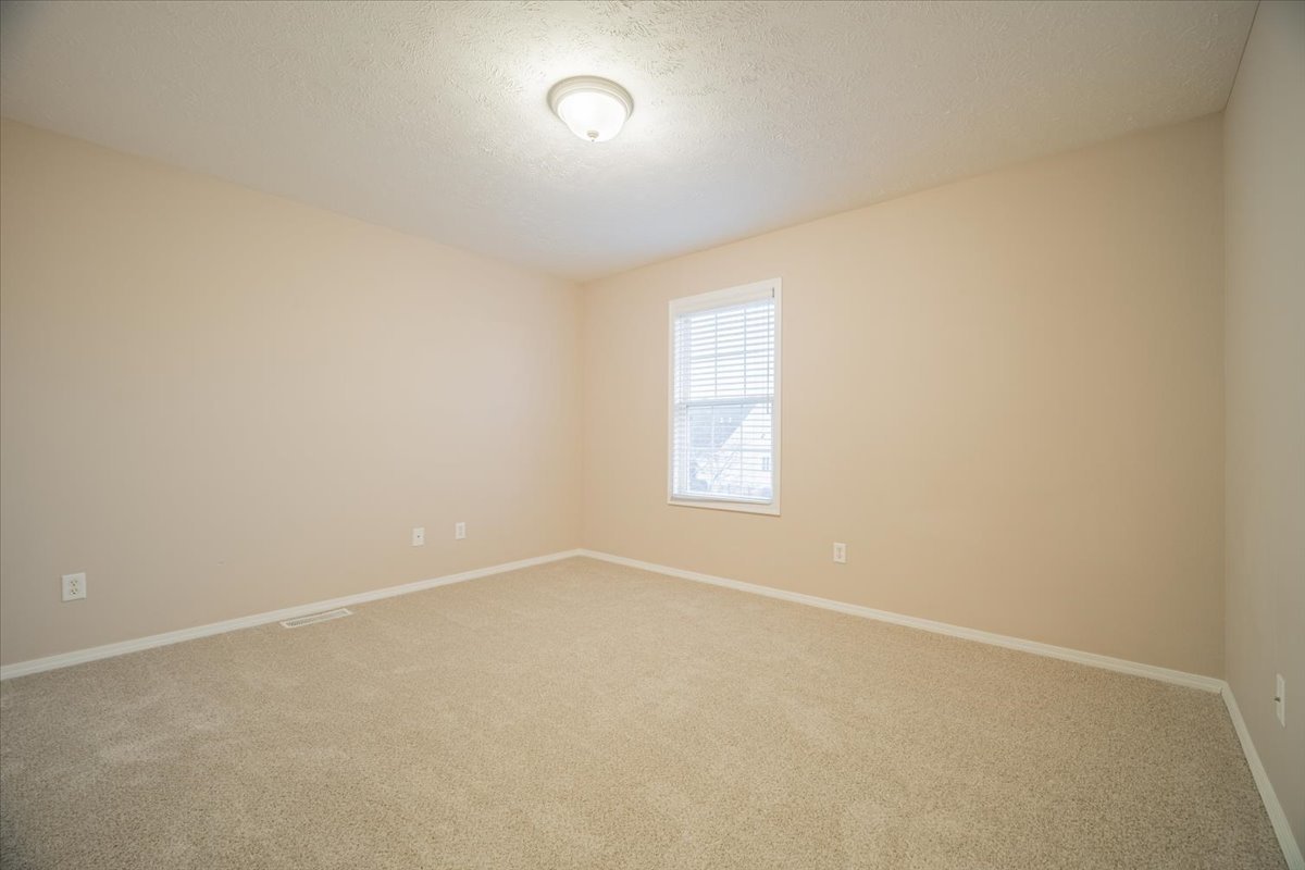 2885 East Raab Road Normal, IL 61761 - Photo 17 of 35 an empty room with a window