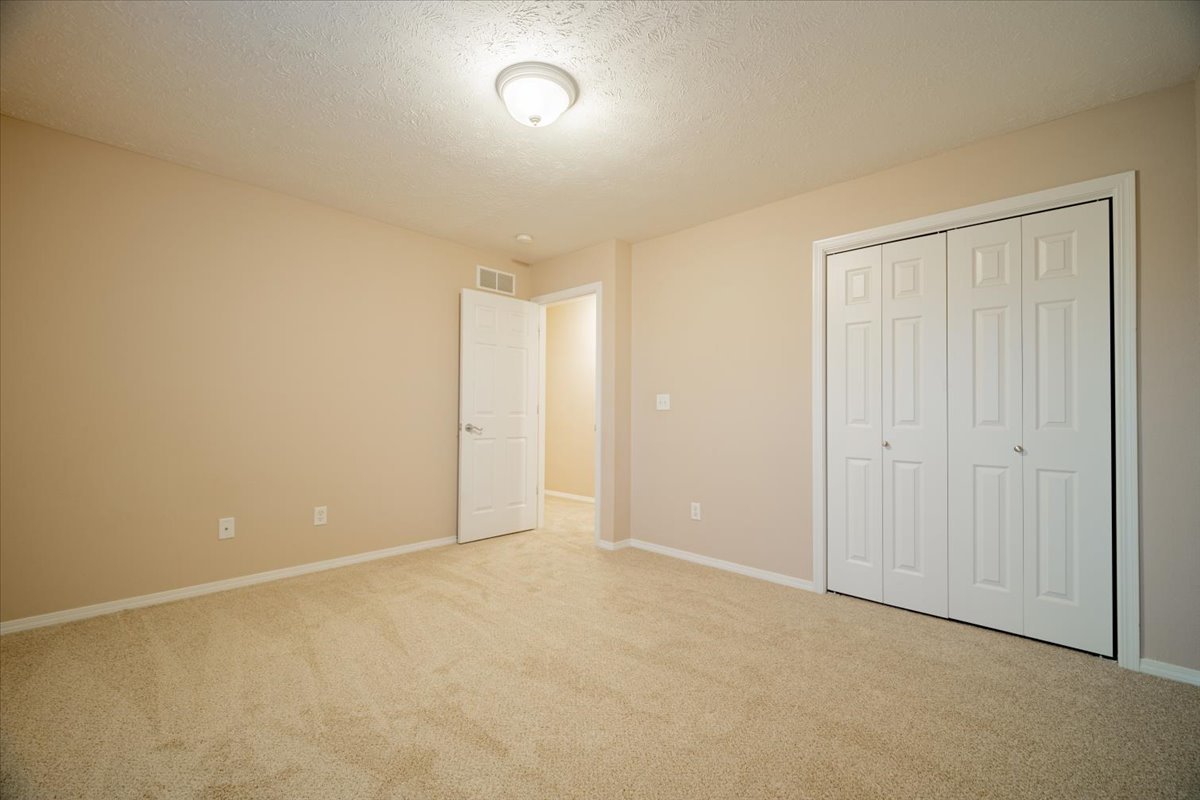 2885 East Raab Road Normal, IL 61761 - Photo 18 of 35 an empty room with an entryway