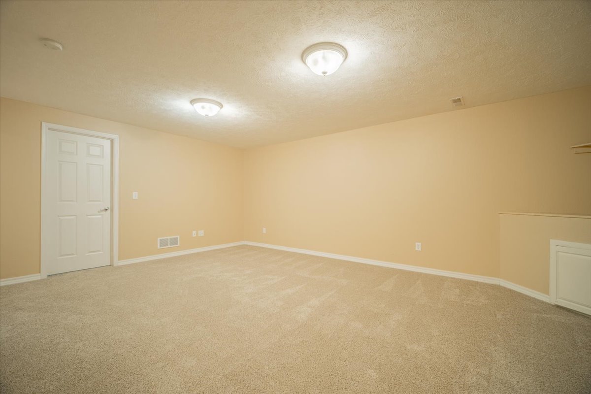2885 East Raab Road Normal, IL 61761 - Photo 24 of 35 an empty room with an entryway