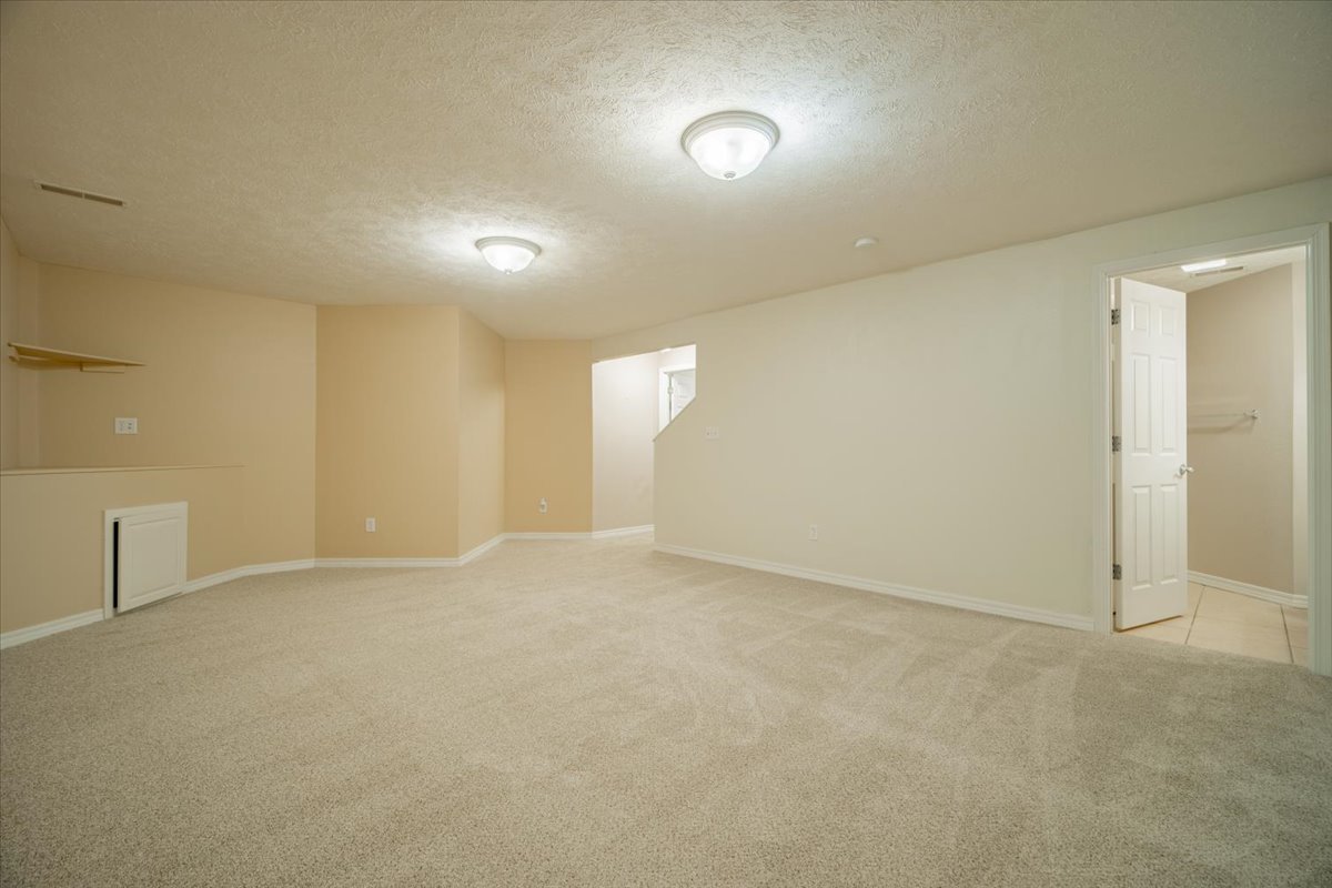 2885 East Raab Road Normal, IL 61761 - Photo 25 of 35 an empty room with windows and entrance to other room