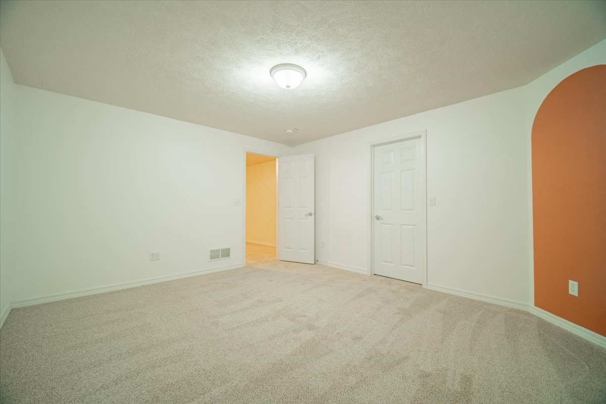 2885 East Raab Road Normal, IL 61761 - Photo 27 of 35 an empty room with an entryway