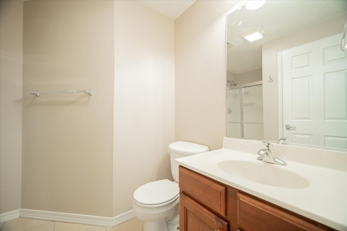 2885 East Raab Road Normal, IL 61761 - Photo 28 of 35 a bathroom with a sink toilet and a mirror