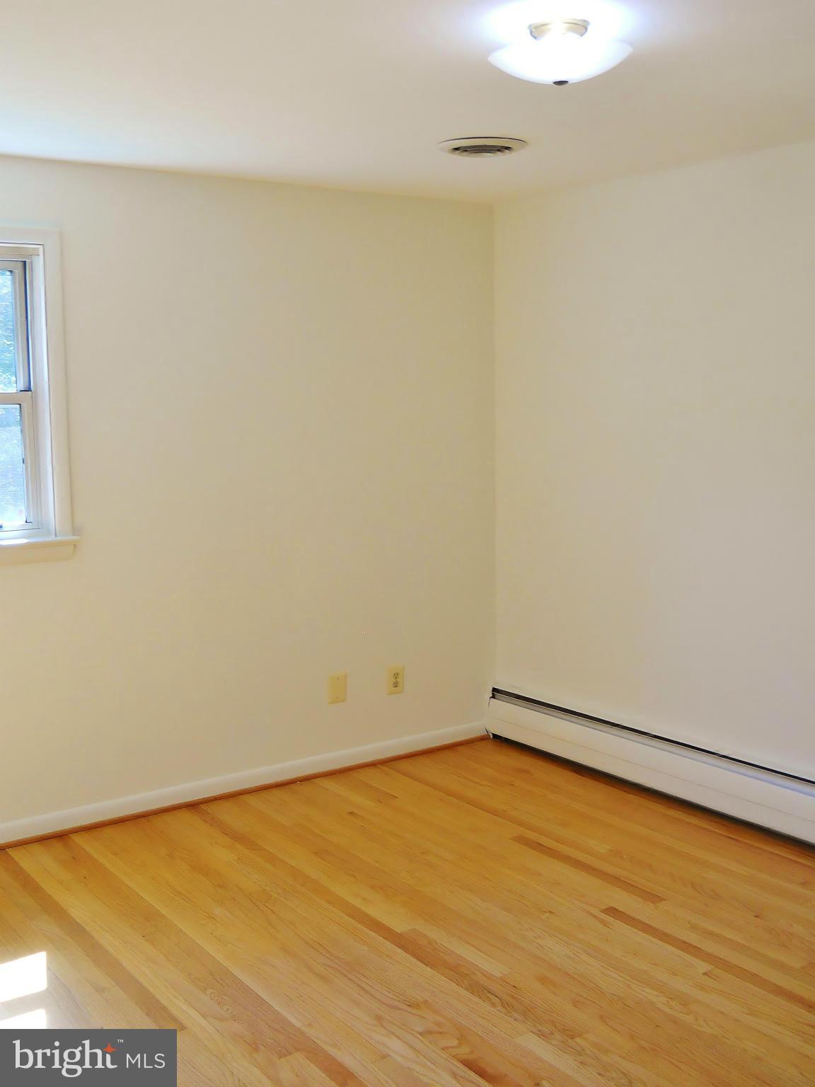 7930 Belgaro Road Laurel, MD 20723 - Photo 15 of 30 Master Bedroom w/ Hardwood Floor