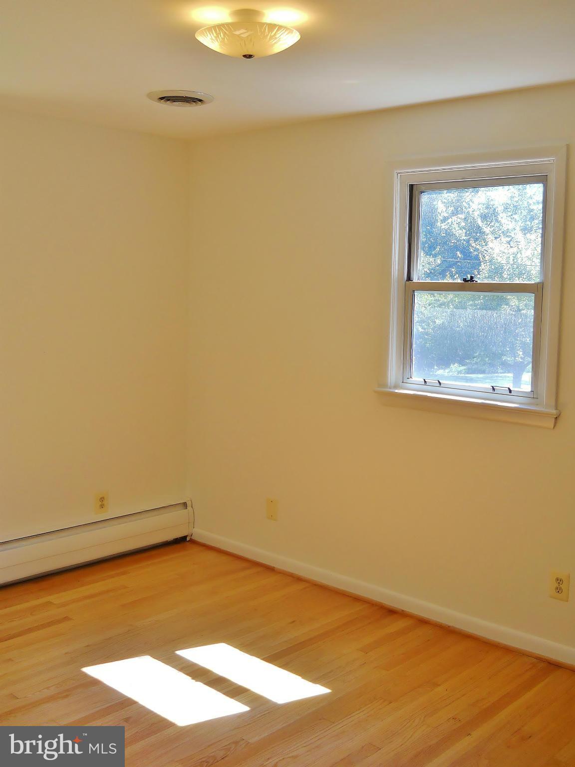 7930 Belgaro Road Laurel, MD 20723 - Photo 19 of 30 2nd Bedroom w/ Hardwood Floor