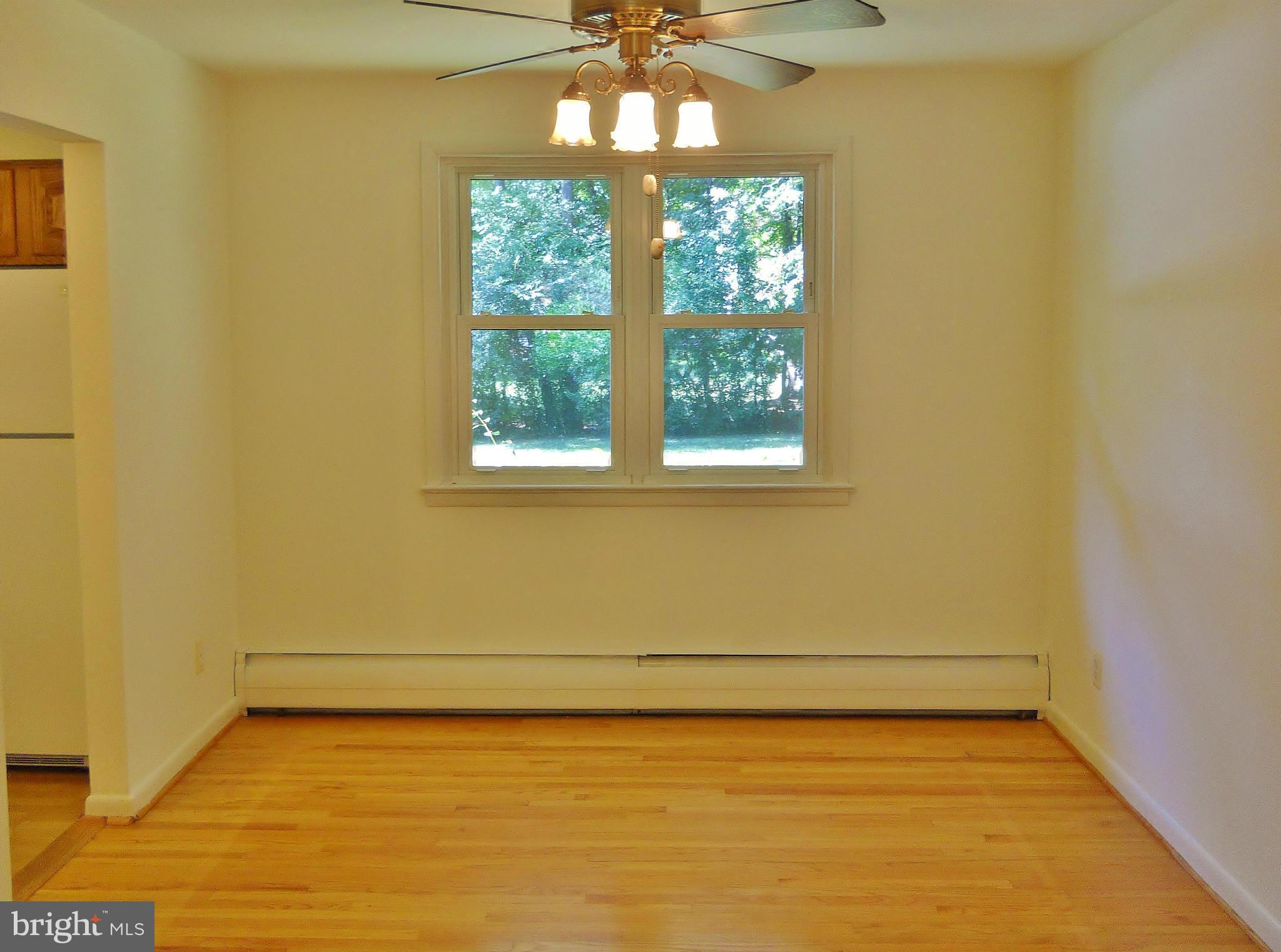 7930 Belgaro Road Laurel, MD 20723 - Photo 9 of 30 Formal Dining Room w/ Hardwood Floor
