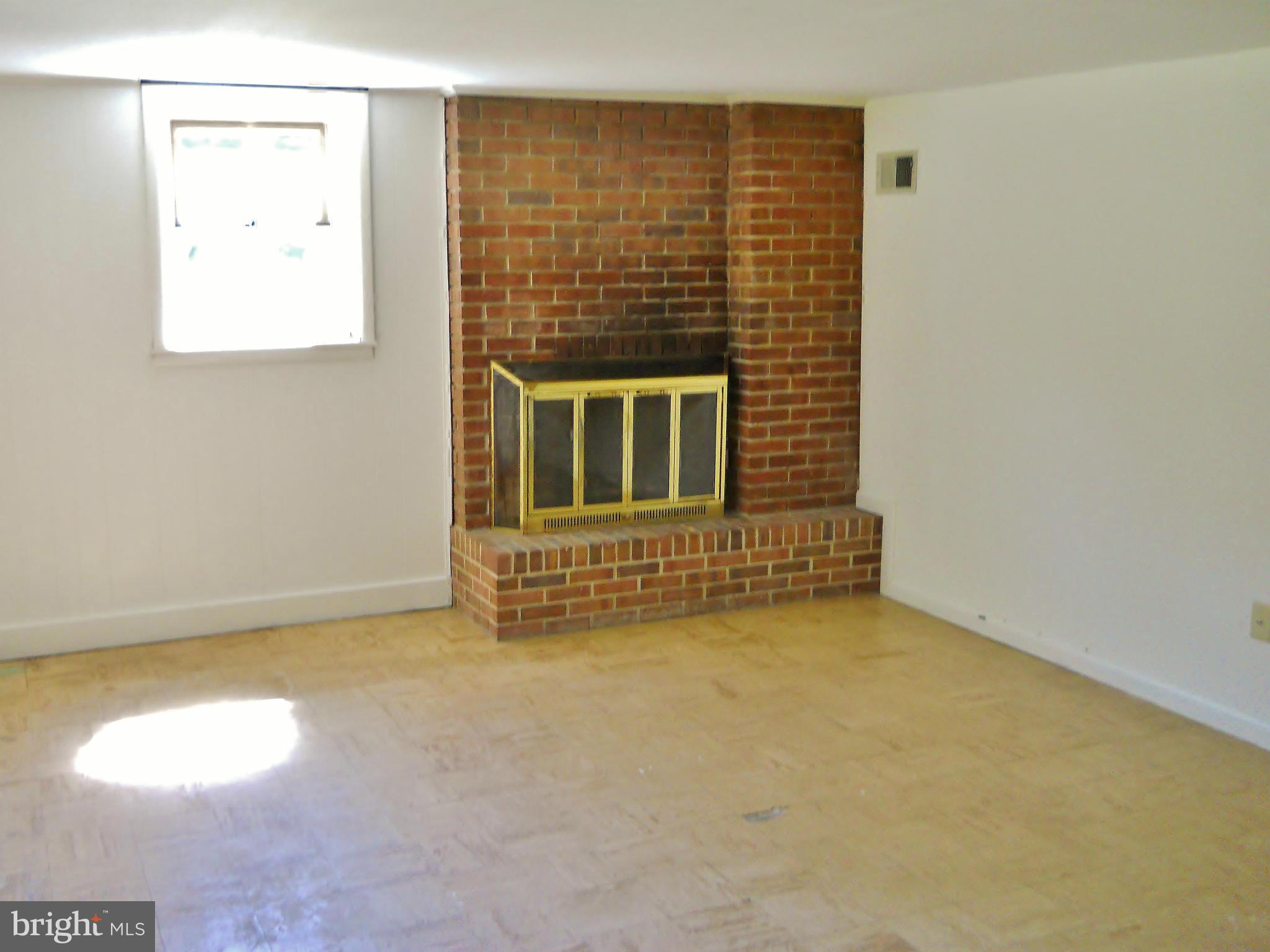 7930 Belgaro Road Laurel, MD 20723 - Photo 10 of 30 Family Room w/ Wood Burning Fireplace