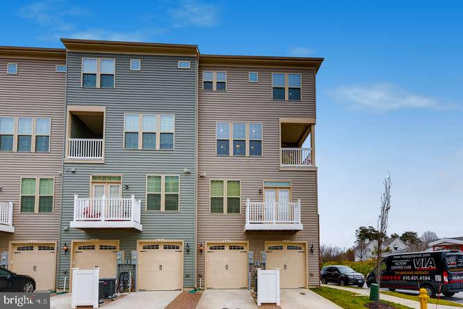 823 Orchard Tree Road, Unit 49 Odenton, MD 21113 - Photo 26 of 28 Rear parking & Garage area
