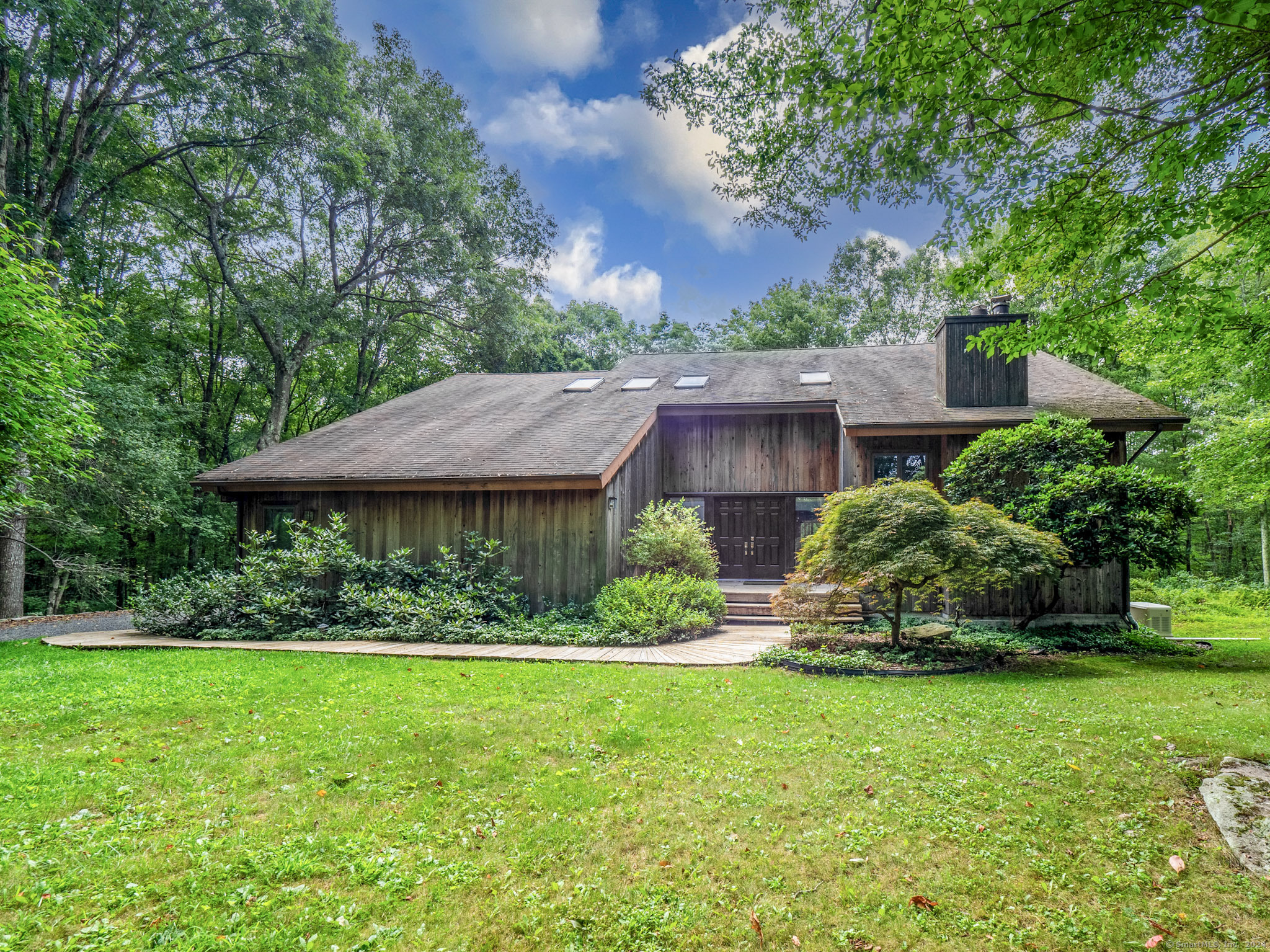 68 Dorethy Road Redding, CT 06896 - Photo 1 of 1 a view of a house with a garden