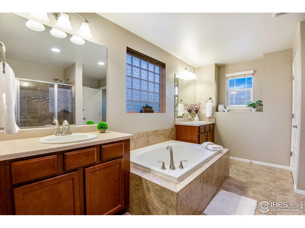 5762 Graphite Street Timnath, CO 80547 - Photo 22 of 27 a bathroom with a sink and a bathtub