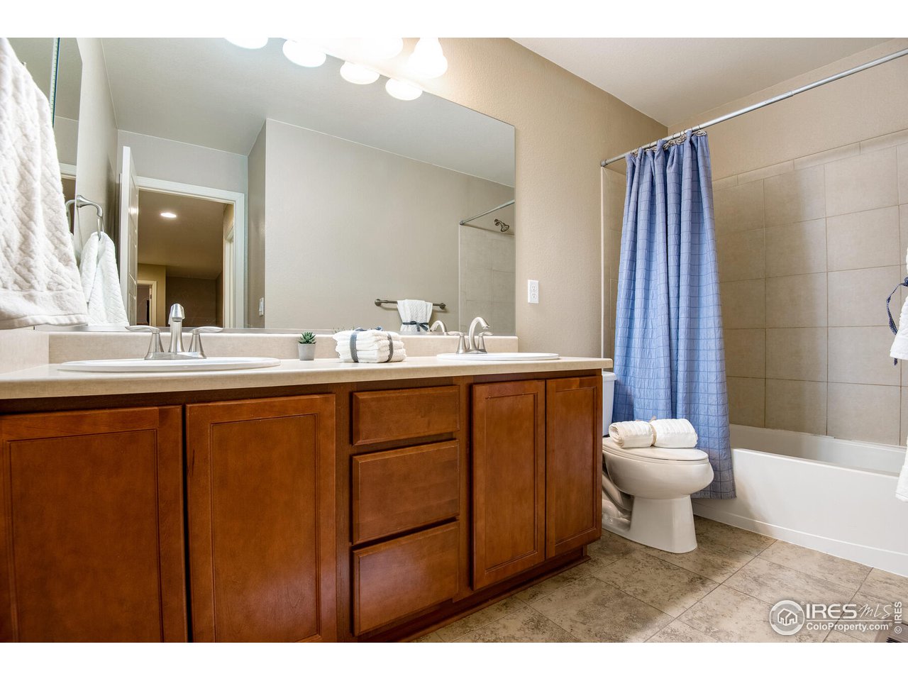 5762 Graphite Street Timnath, CO 80547 - Photo 25 of 27 a bathroom with a sink toilet and shower