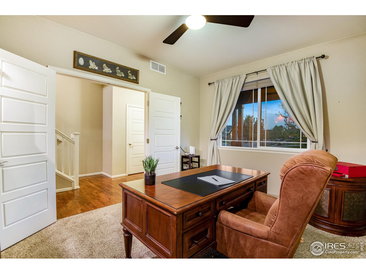 5762 Graphite Street Timnath, CO 80547 - Photo 7 of 27 a living room with furniture and a window