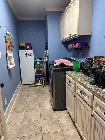 a bedroom with a bed window and a chair