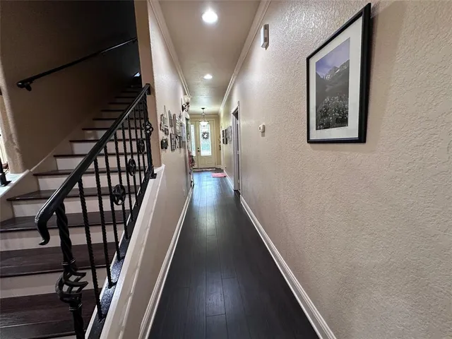 a bedroom with bed and a chandelier