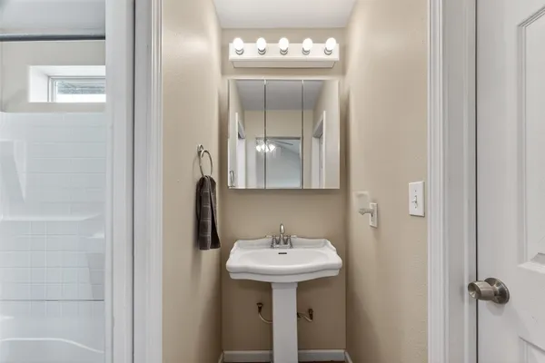 a bathroom with a sink and a mirror