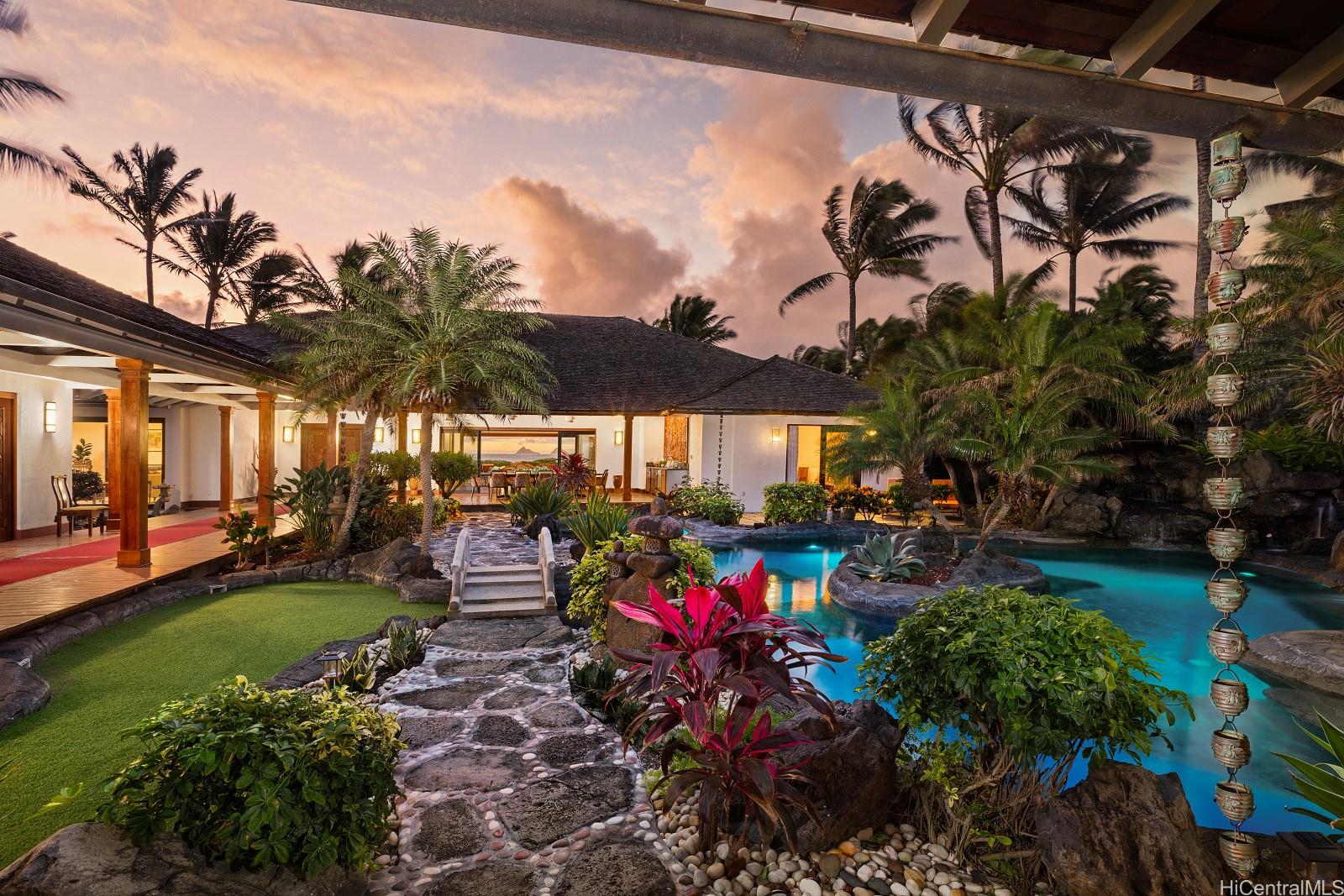 a view of a backyard with plants and patio