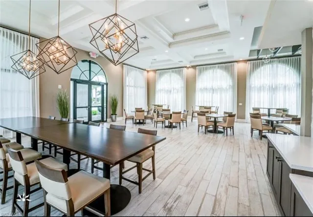 a large kitchen with a table and chairs